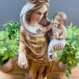 Statue of the Virgin holding the Child Jesus in polychrome terracotta.