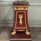Pair of plaster bases imitating porphyry and gilded bronze circa 1980.