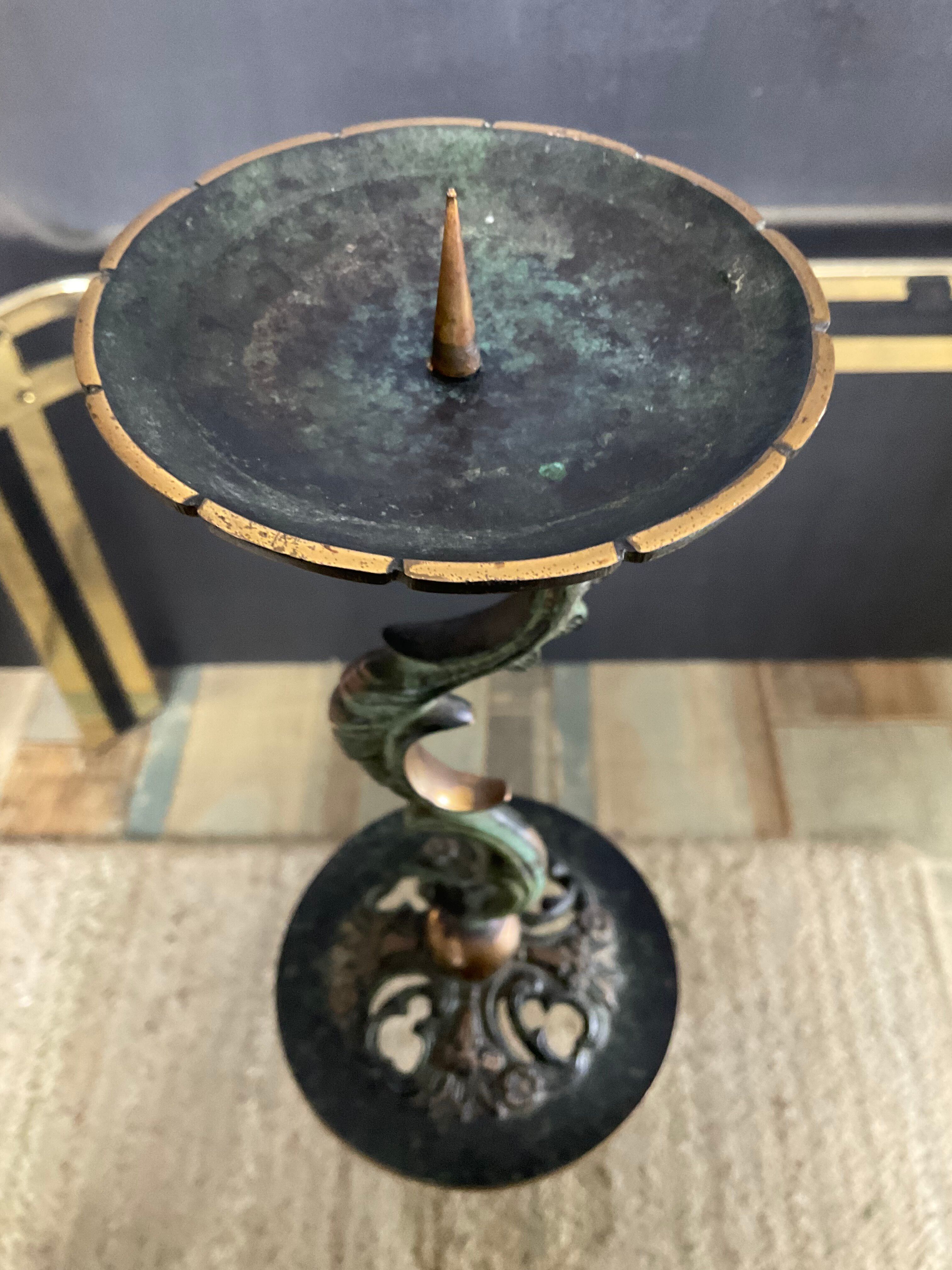 Empire style bronze candlestick with a candle holder
