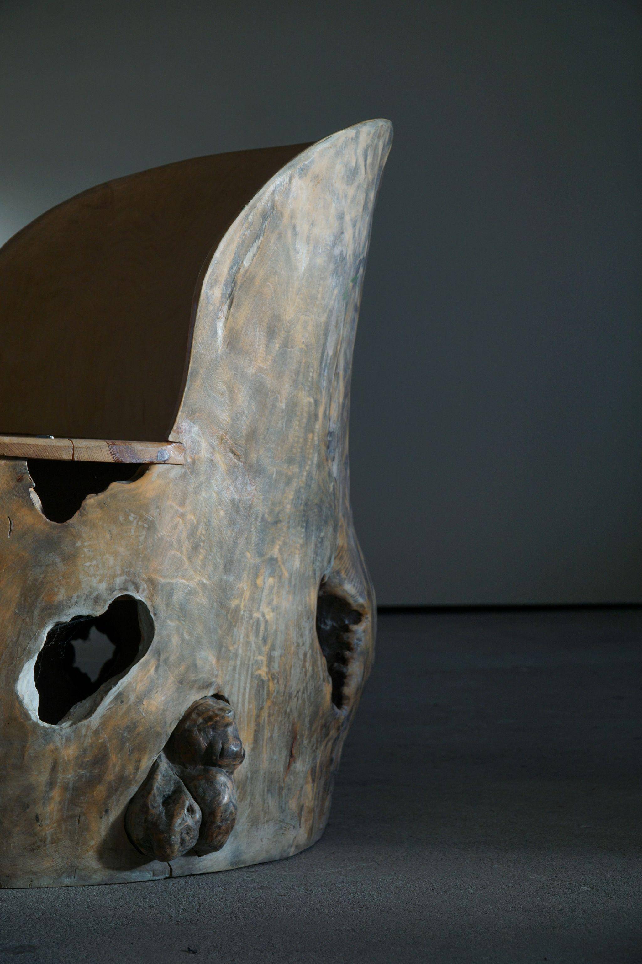 Sculptural Norwegian trunk chair in mid-century brutalist solid wood.