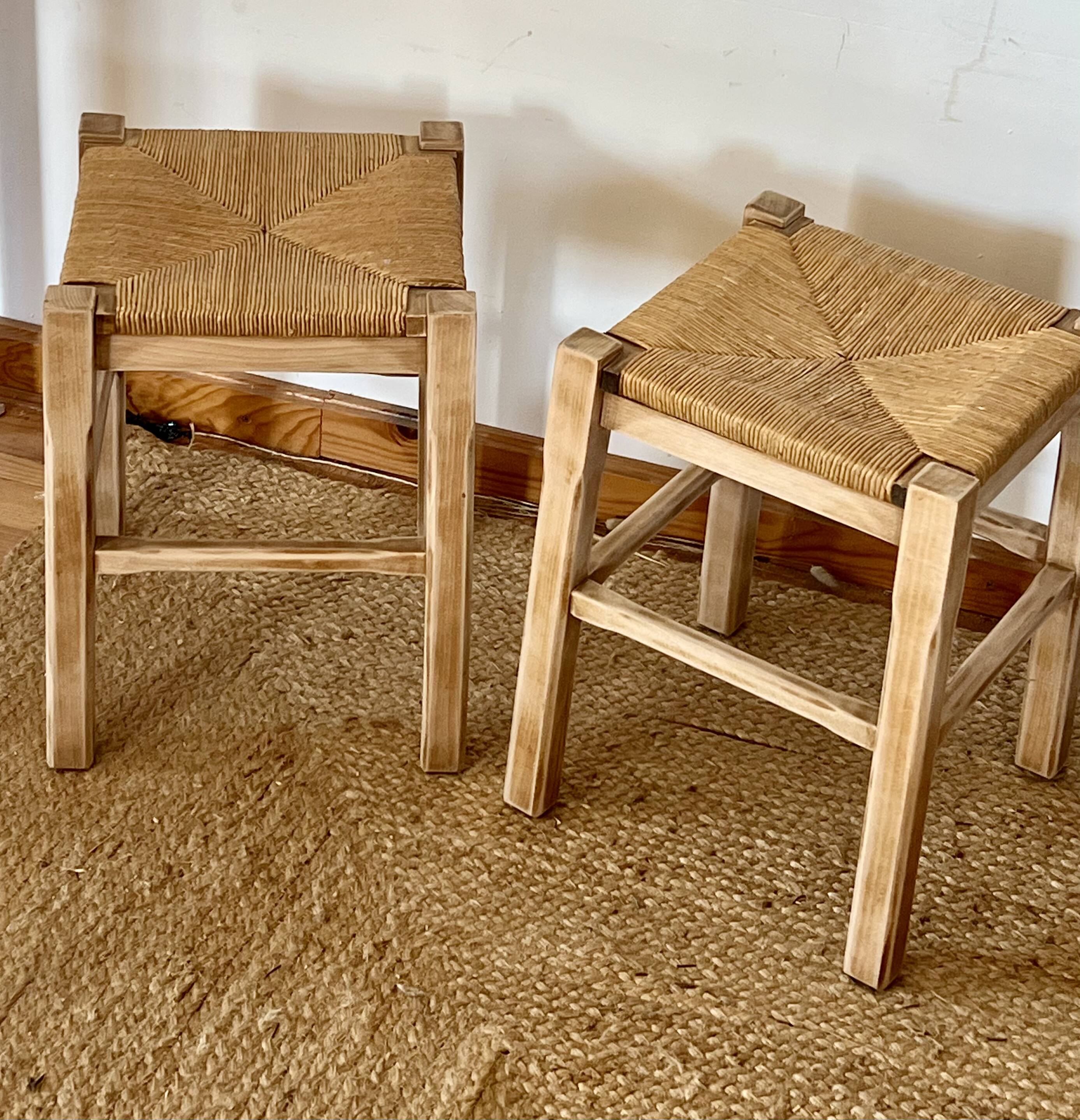 Pair of antique stools in raw solid wood with straw seats.