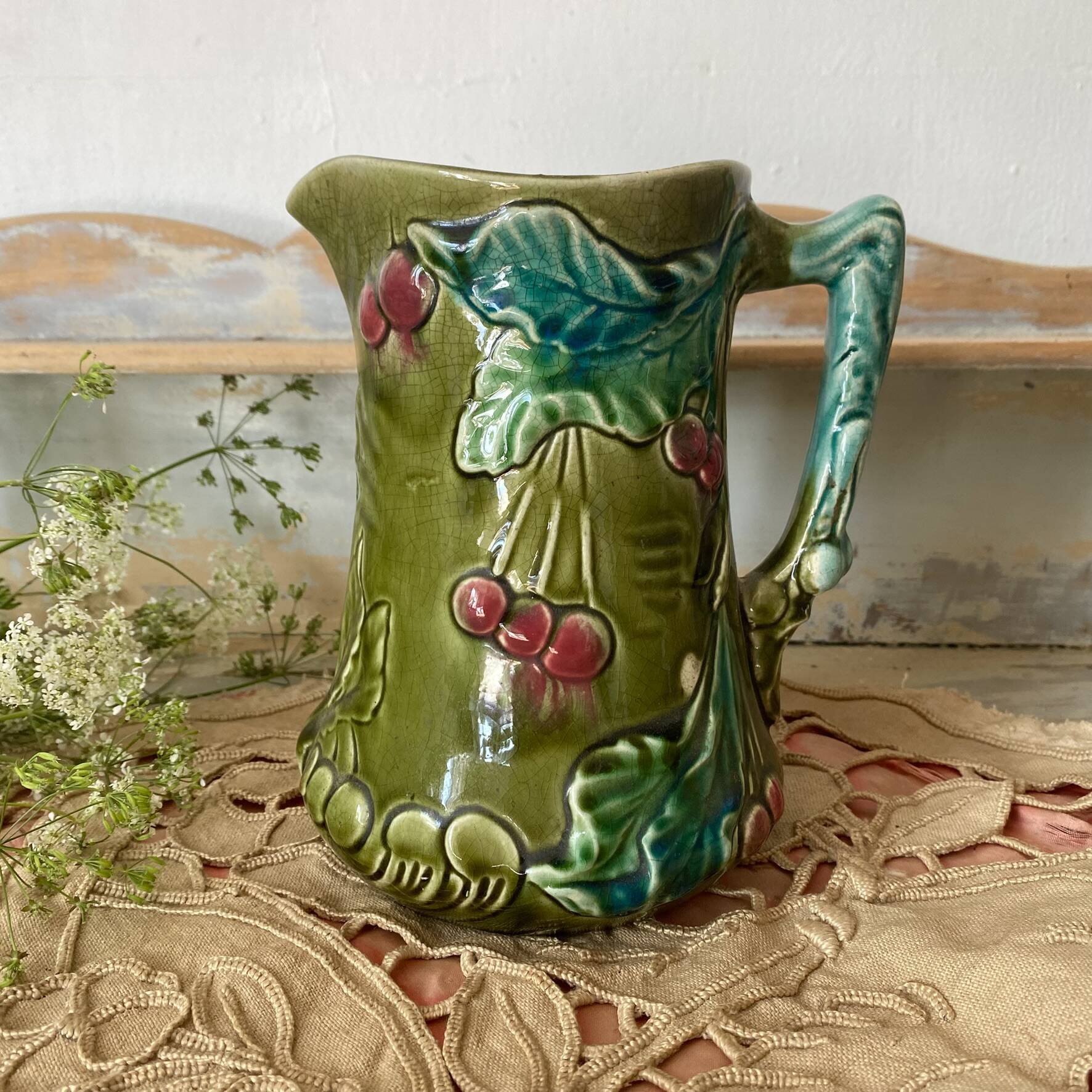 antique jug in slipware with cherry decoration