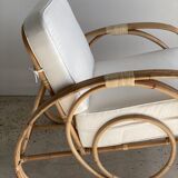 Large rattan rest chair and white cushions