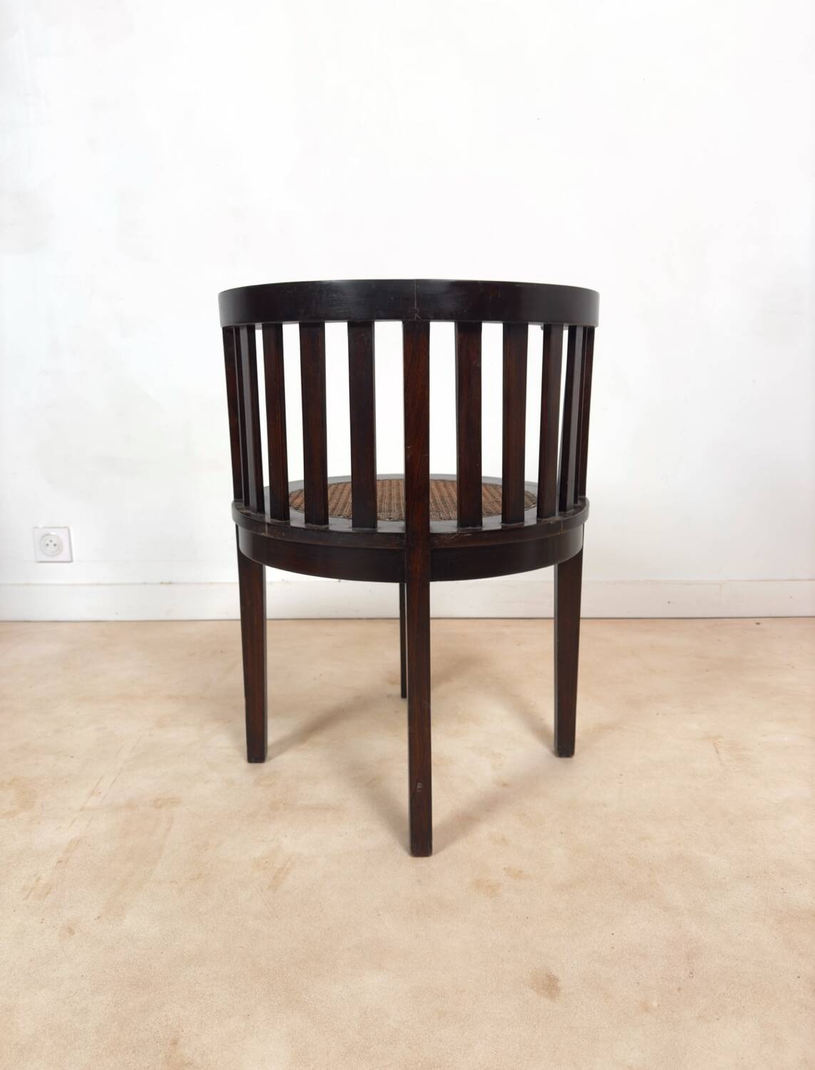 Colonial "Art Deco" armchair in wood and cane.