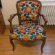 Voltaire armchair with a rack, wheels, and a toad chair in matching fabric.