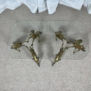 Hollywood Regency style coffee table, 6 patinated brass horses and glass top, 1970.