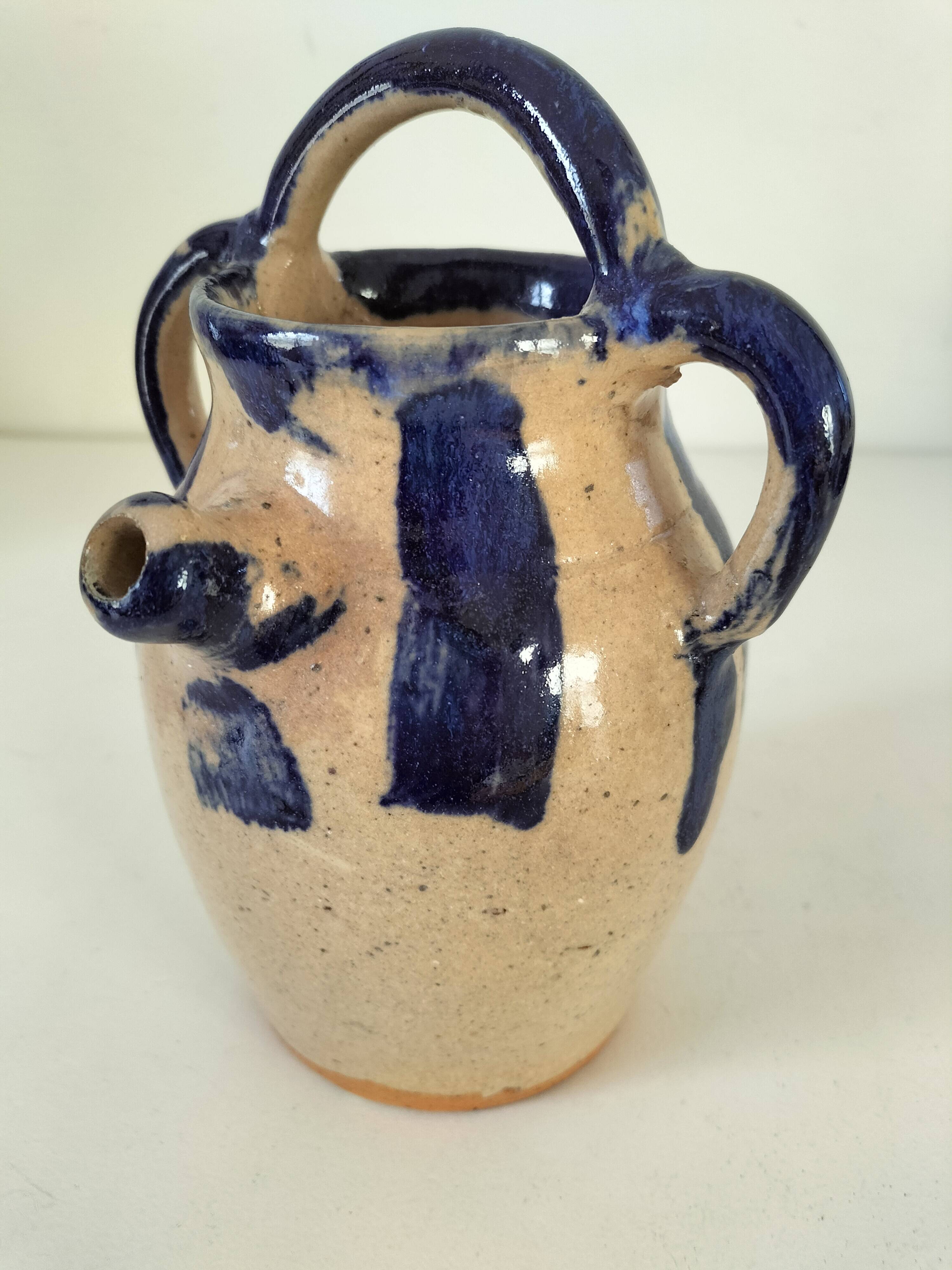 Old pitcher (goat) in cobalt glazed earthenware