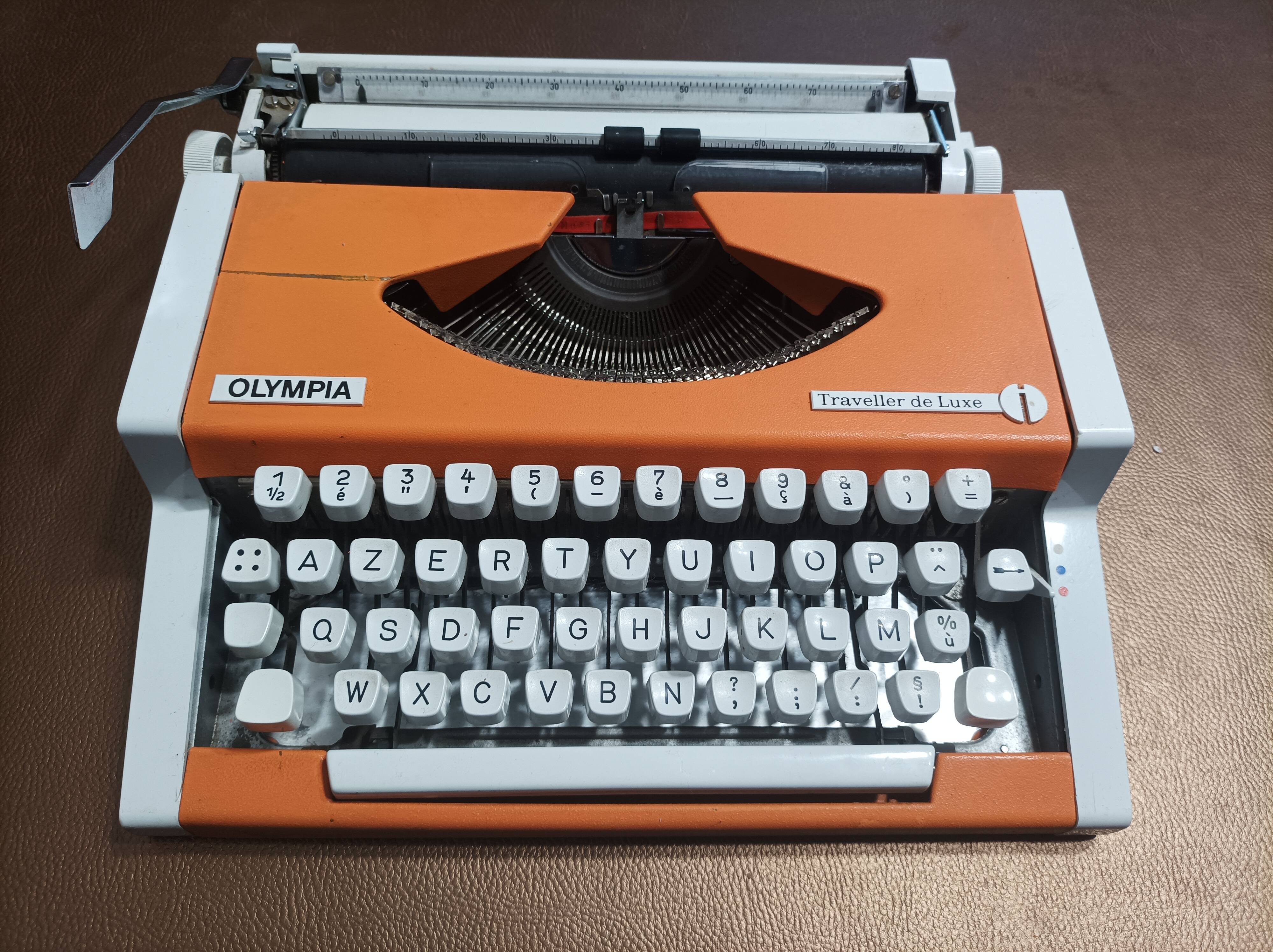 Olympia traveller luxury typewriter orange revised and new ribbon