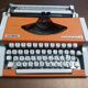 Olympia traveller luxury typewriter orange revised and new ribbon