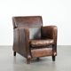 Sleekly shaped timeless design armchair made of sheepskin leather