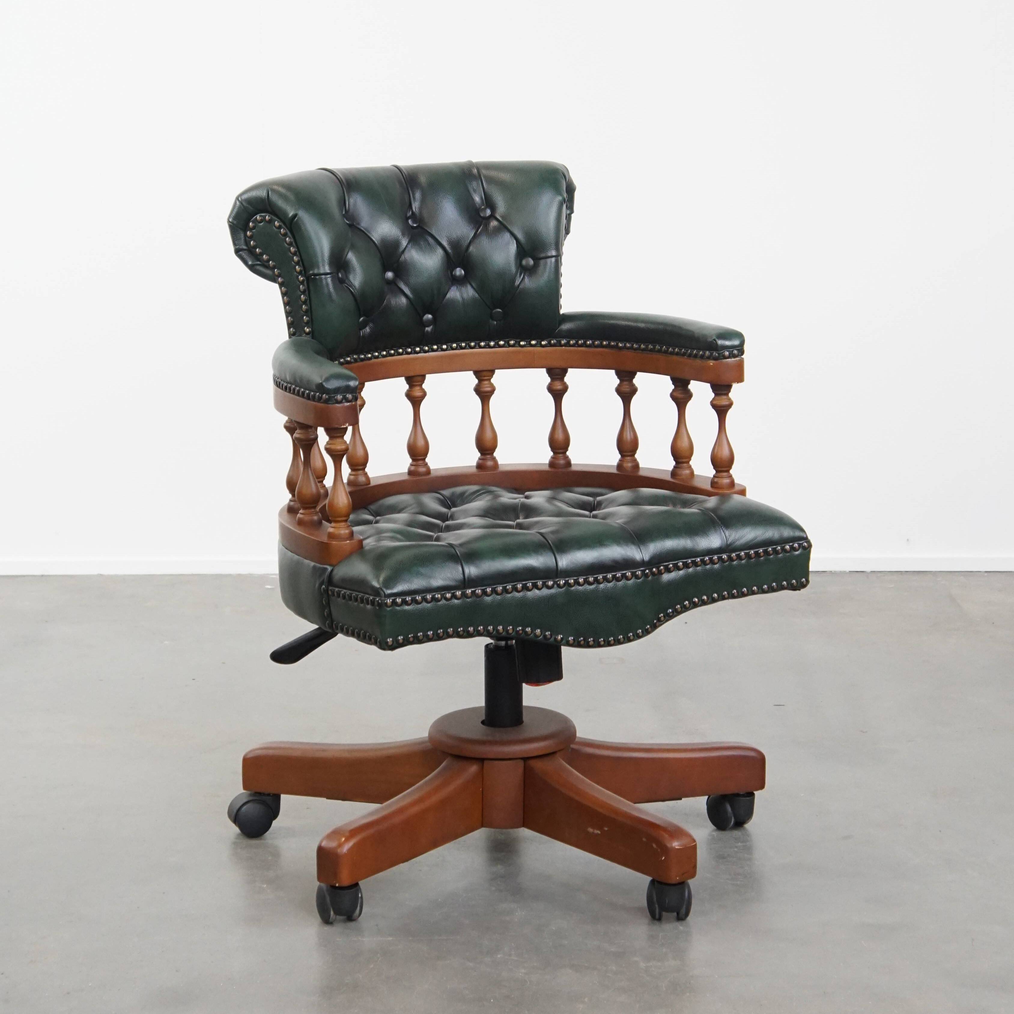 Dark green chesterfield office chair in cowhide leather on wheels