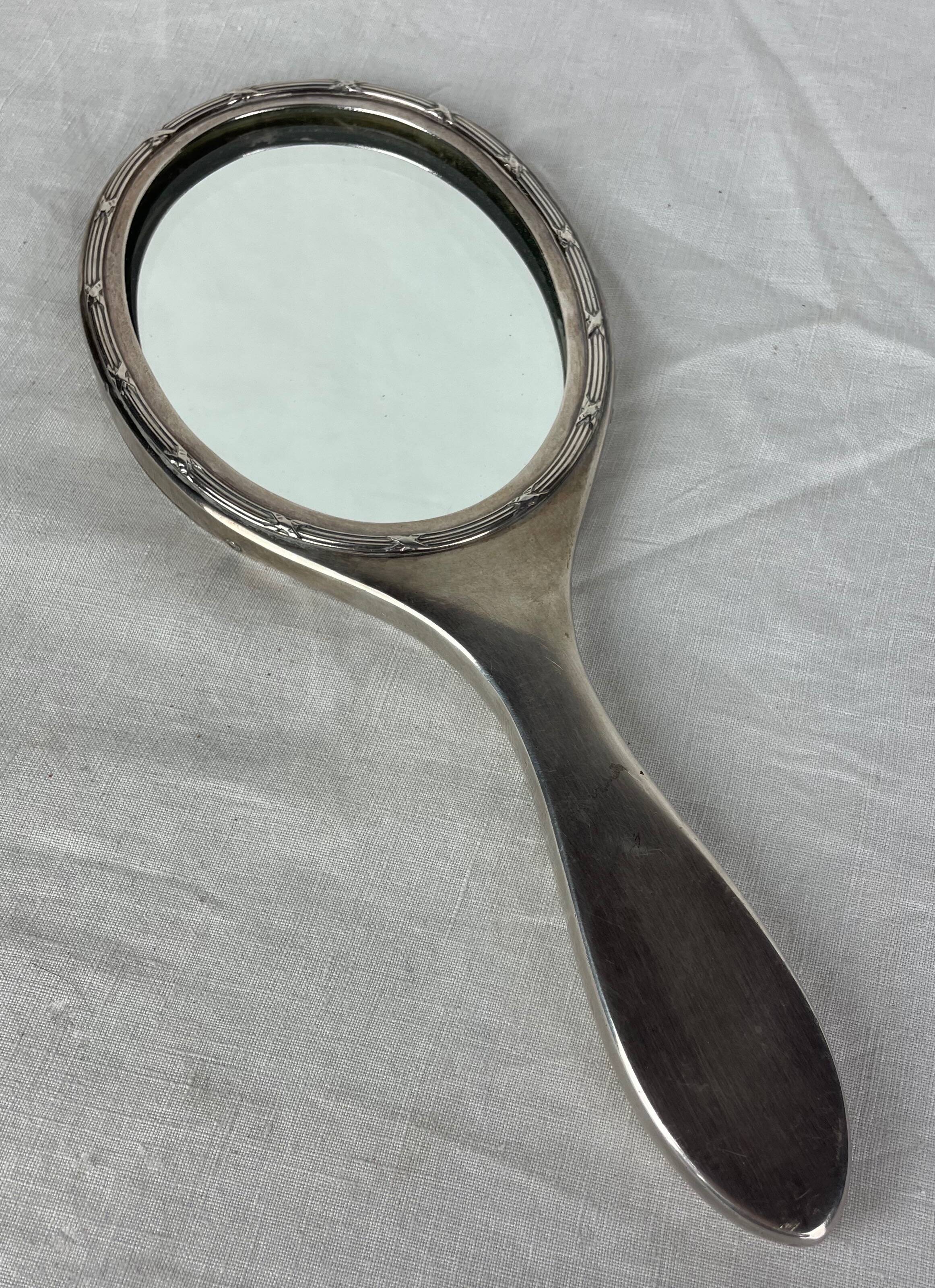 Silver metal hand mirror