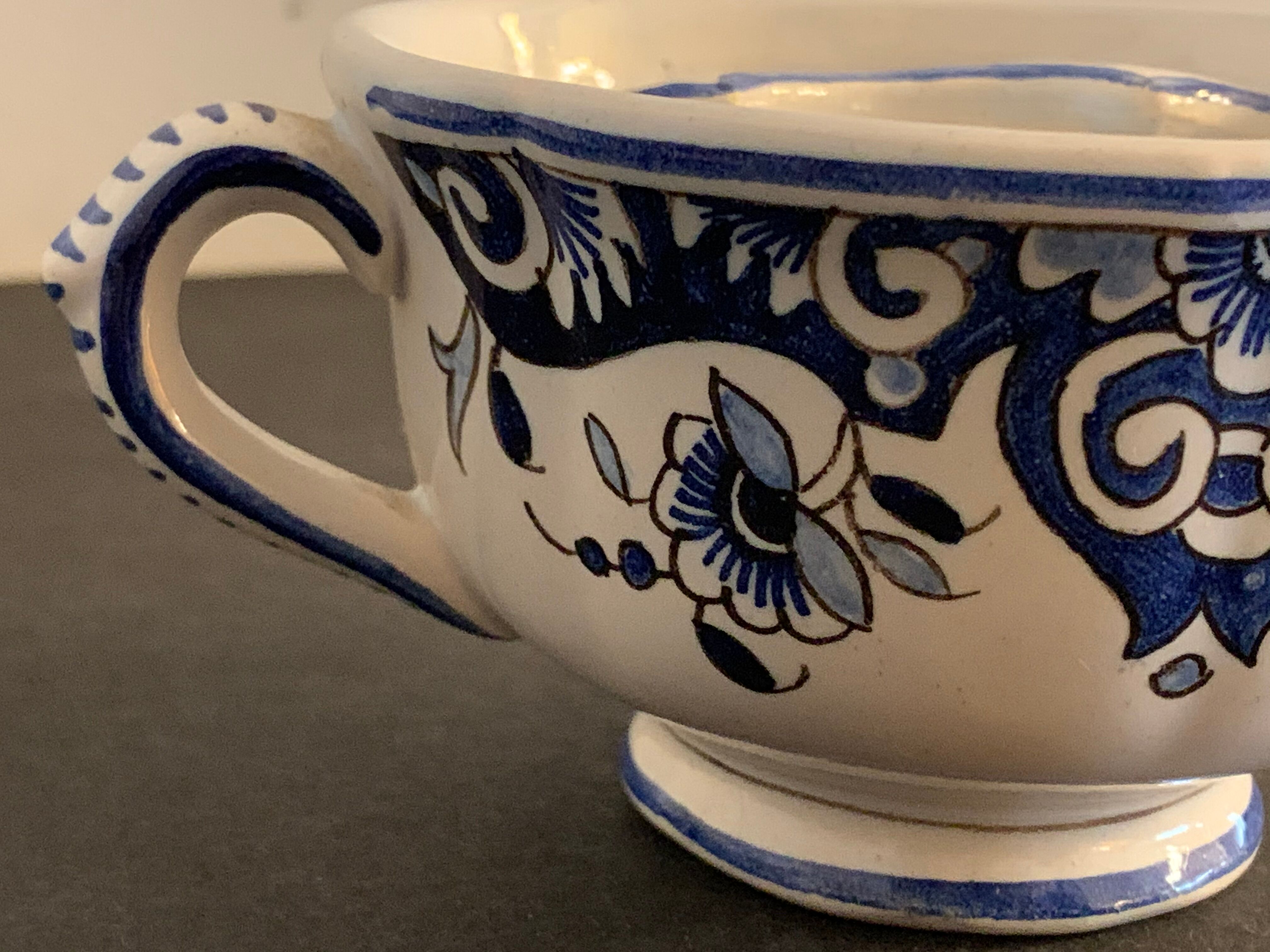 Old mustache cup and its under cup, Rouen earthenware