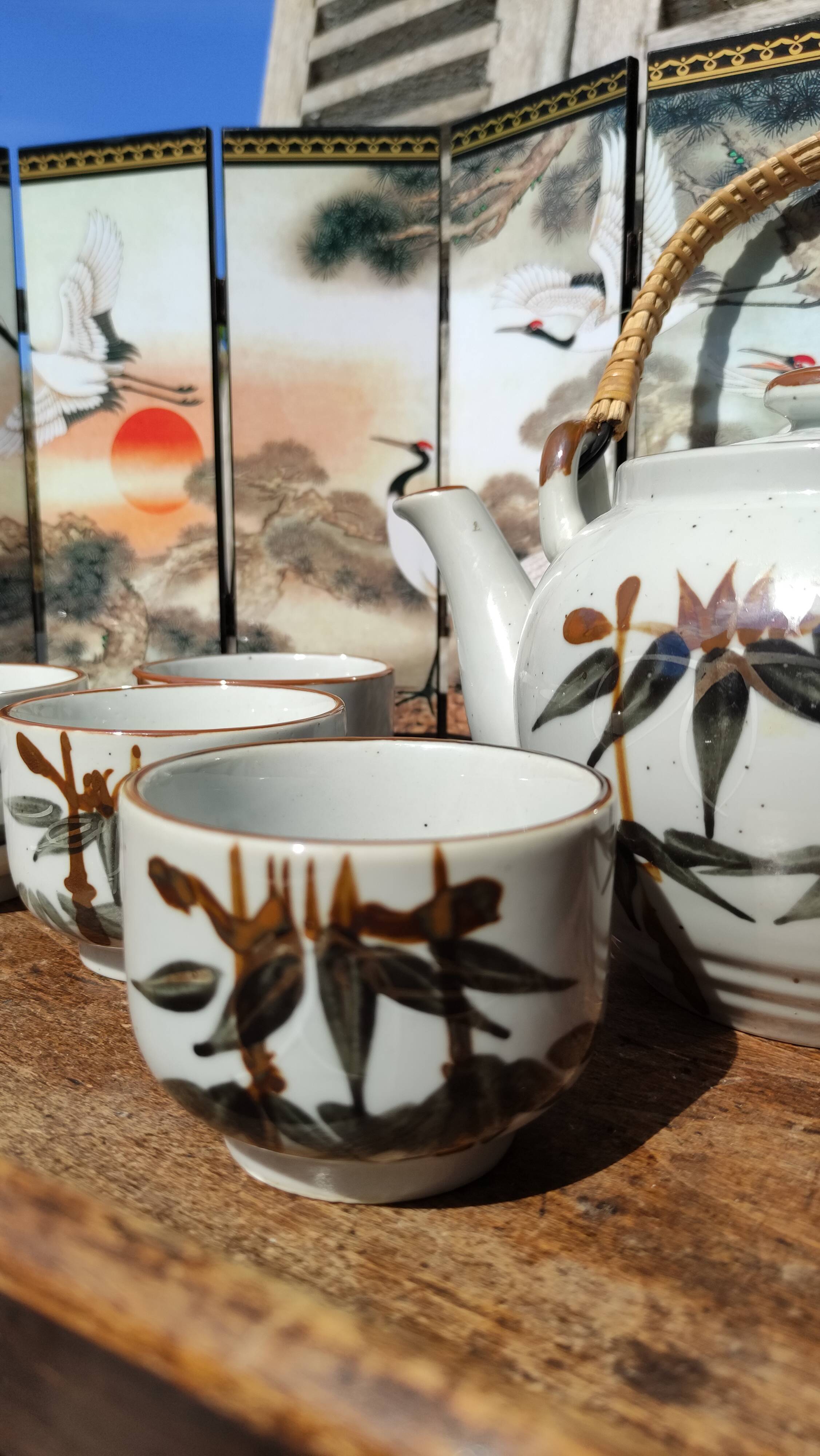 Asian set of a teapot and its cups