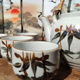 Asian set of a teapot and its cups