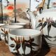 Asian set of a teapot and its cups