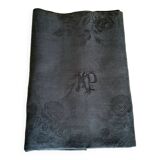 Old damask tablecloth with monogram