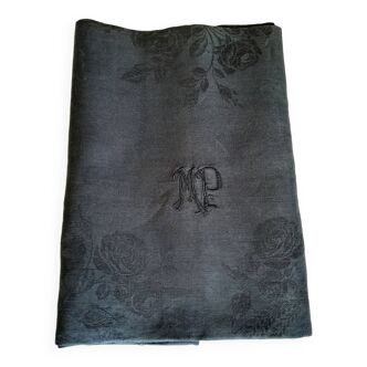 Old damask tablecloth with monogram