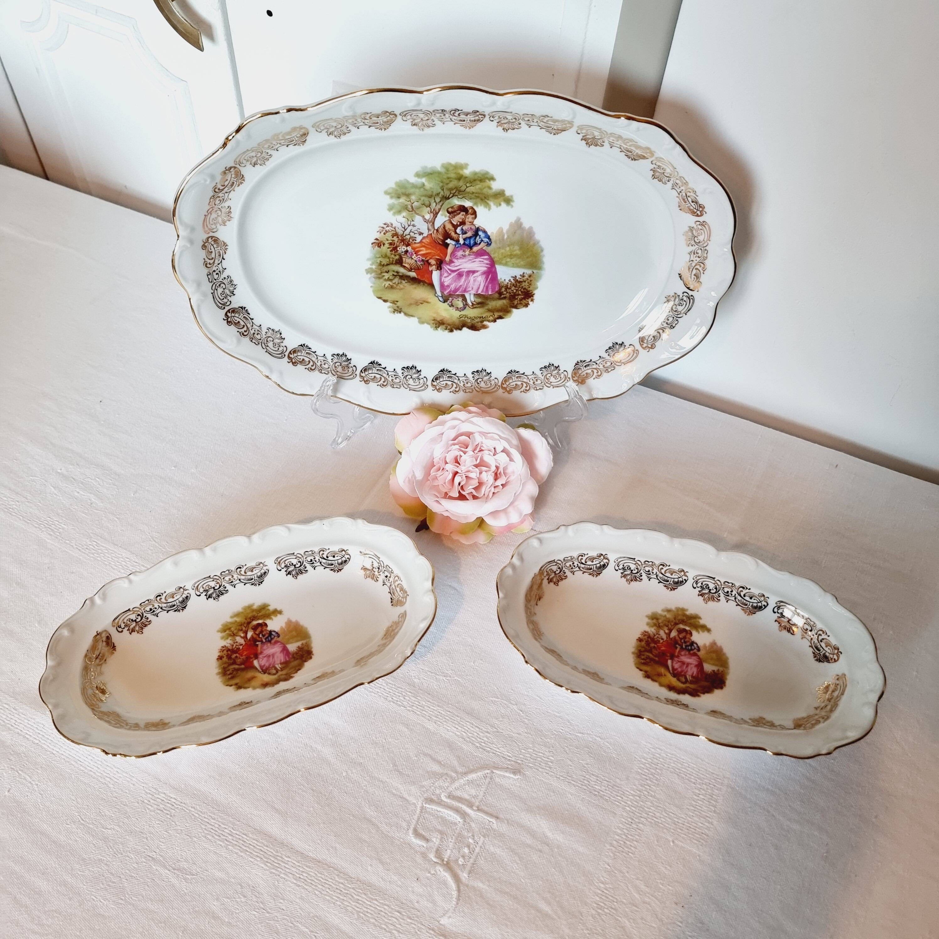 3 serving dishes with frangonard romantic scene with designs and borders in 24 carat gold.