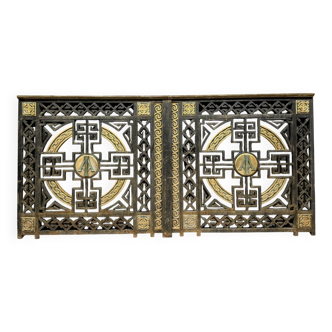 pair of monogrammed cast iron doors from the Art Deco period