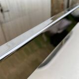 Coffee table with chrome base and mirrored glass top, vintage solar flare decor