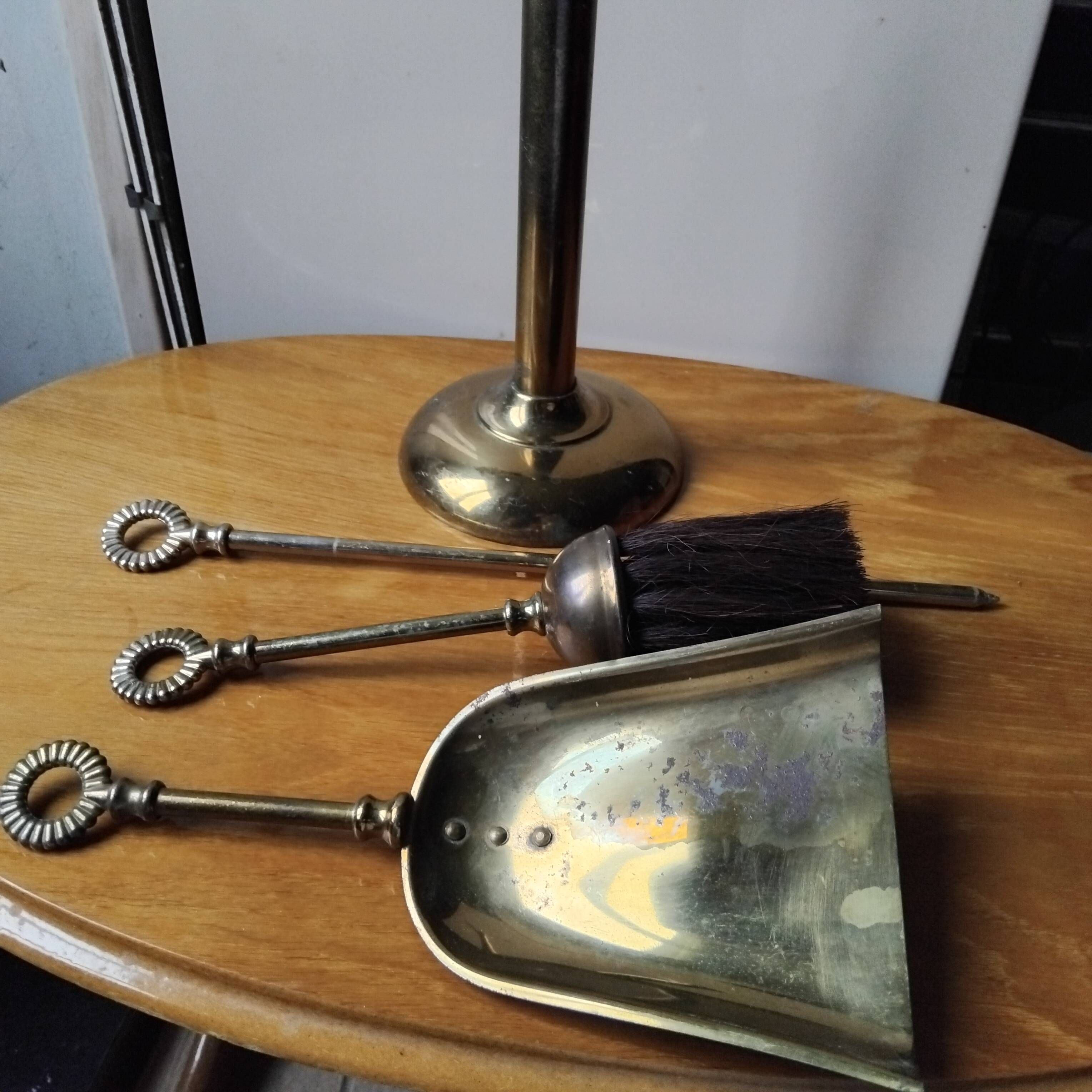 Small and discreet brass fireplace tool set.