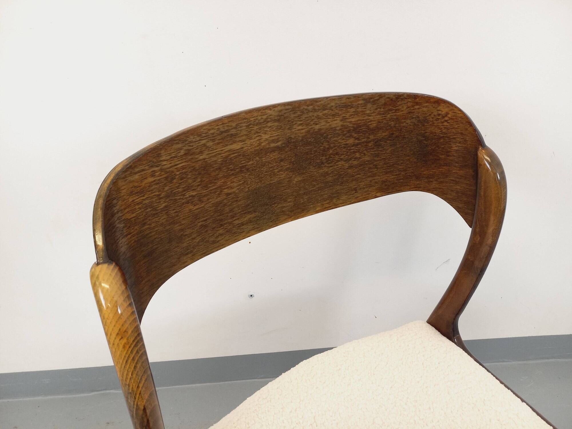 Vintage sled chair by Baumann in wood and boucle fabric.