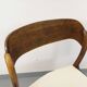 Vintage sled chair by Baumann in wood and boucle fabric.