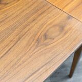 Dining table, 1960s, in walnut, slightly elliptical shape.