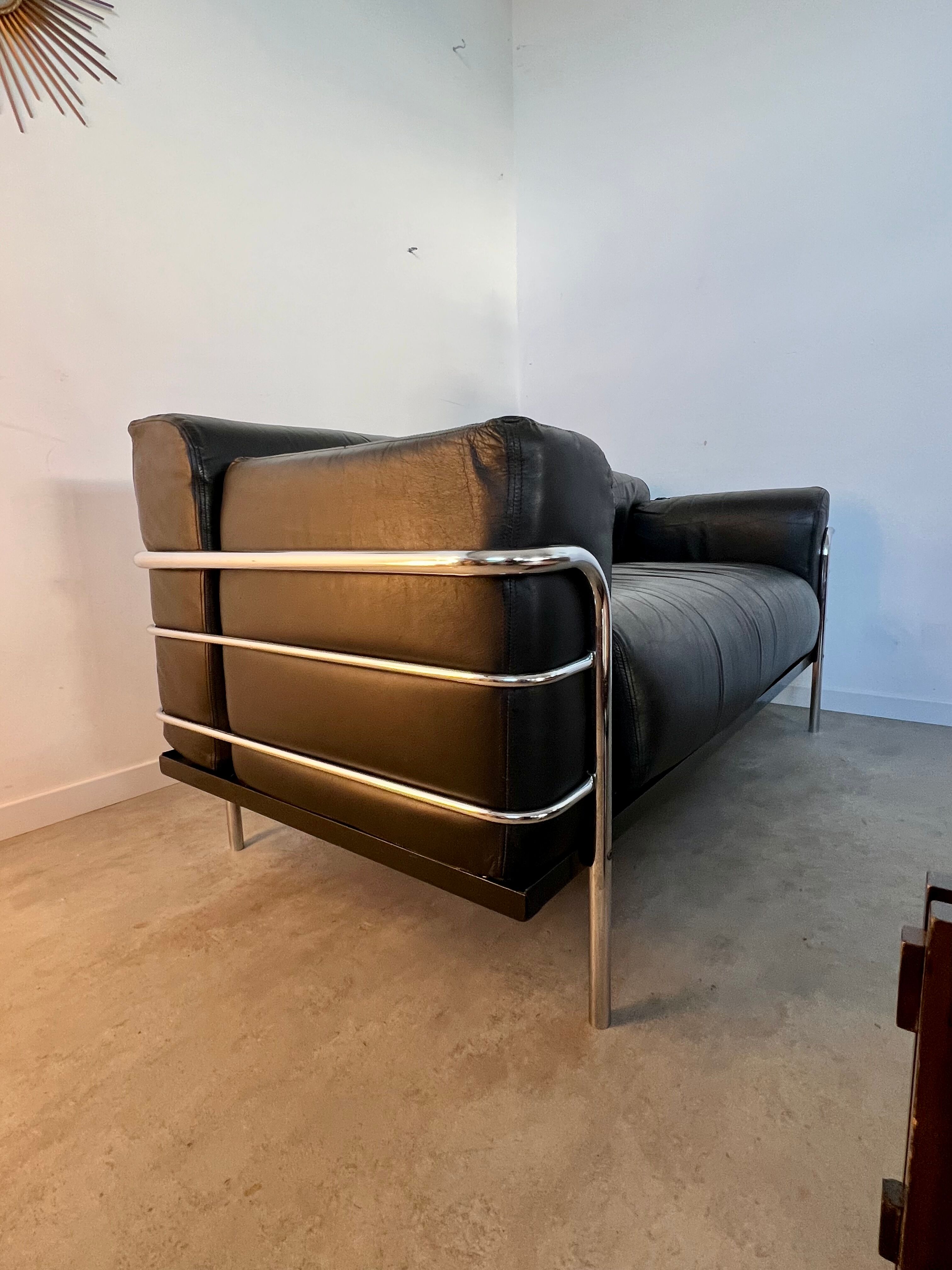 Old vintage leather and tubular metal sofa, design 70s