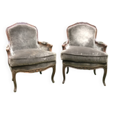Pair of Louis XV style bergères in moulded and carved wood.