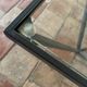 Design coffee table in glass and black metal – Geometric base