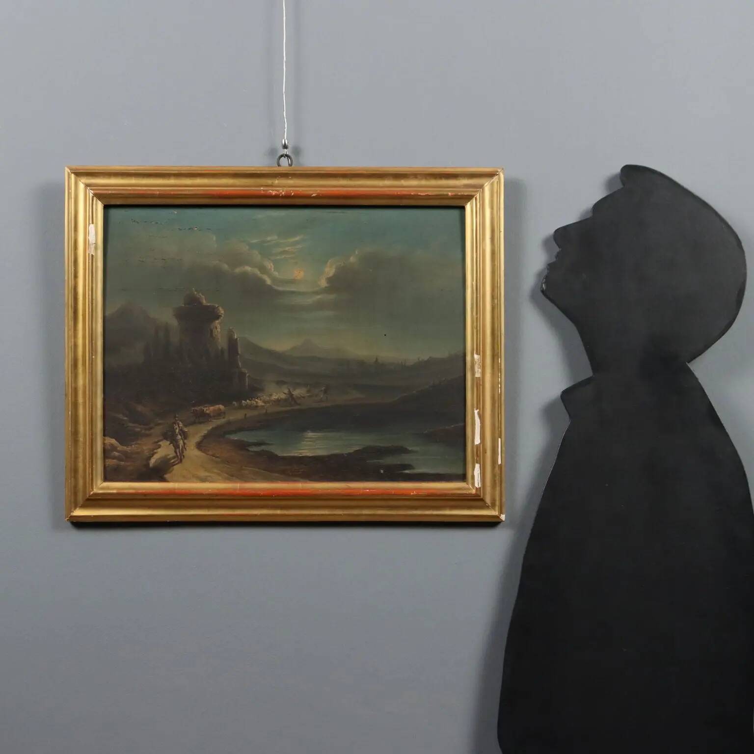 Old painting of a nocturnal landscape in oil on panel from the 19th century.