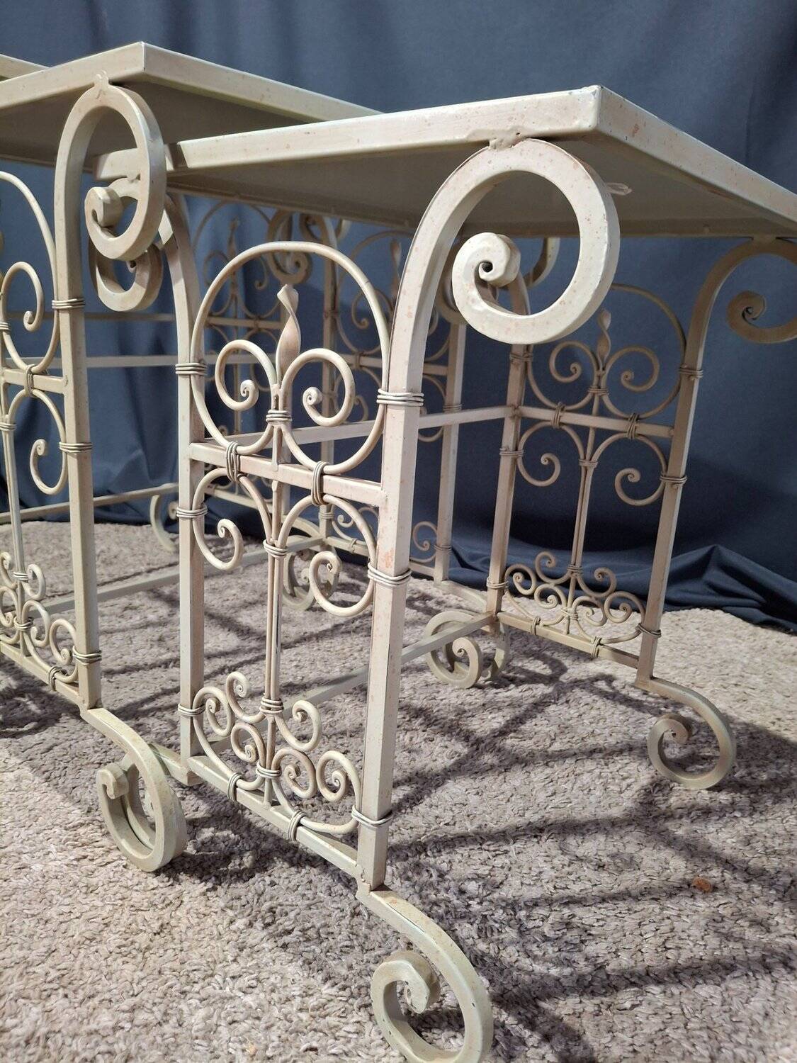 Nesting tables in patinated iron.