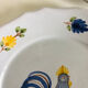 Pair of plates with naive Eastern rooster decoration