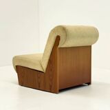 Vintage mid-century beige armchair with wooden frame and ottoman