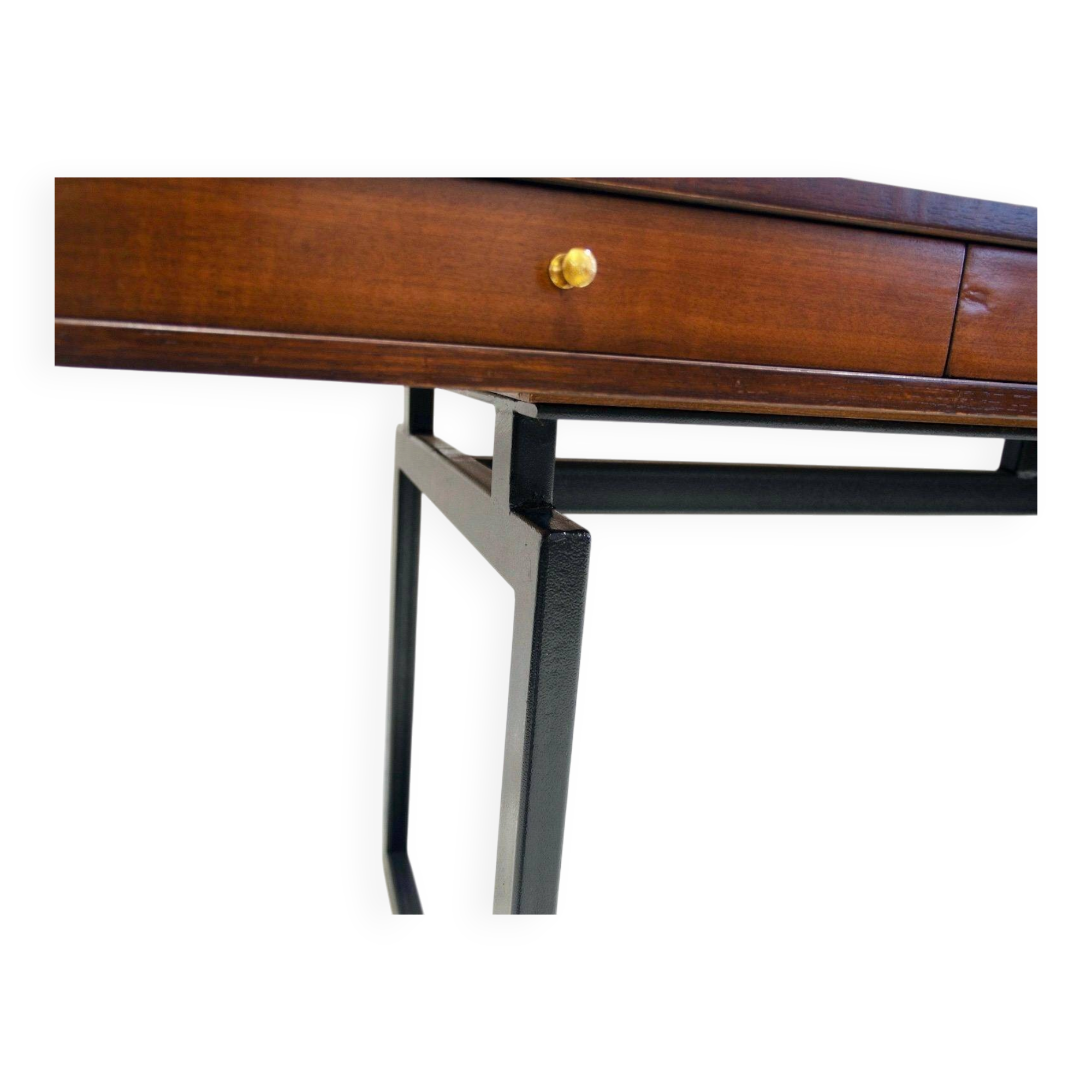 Wooden desk with drawers and black lacquered legs.