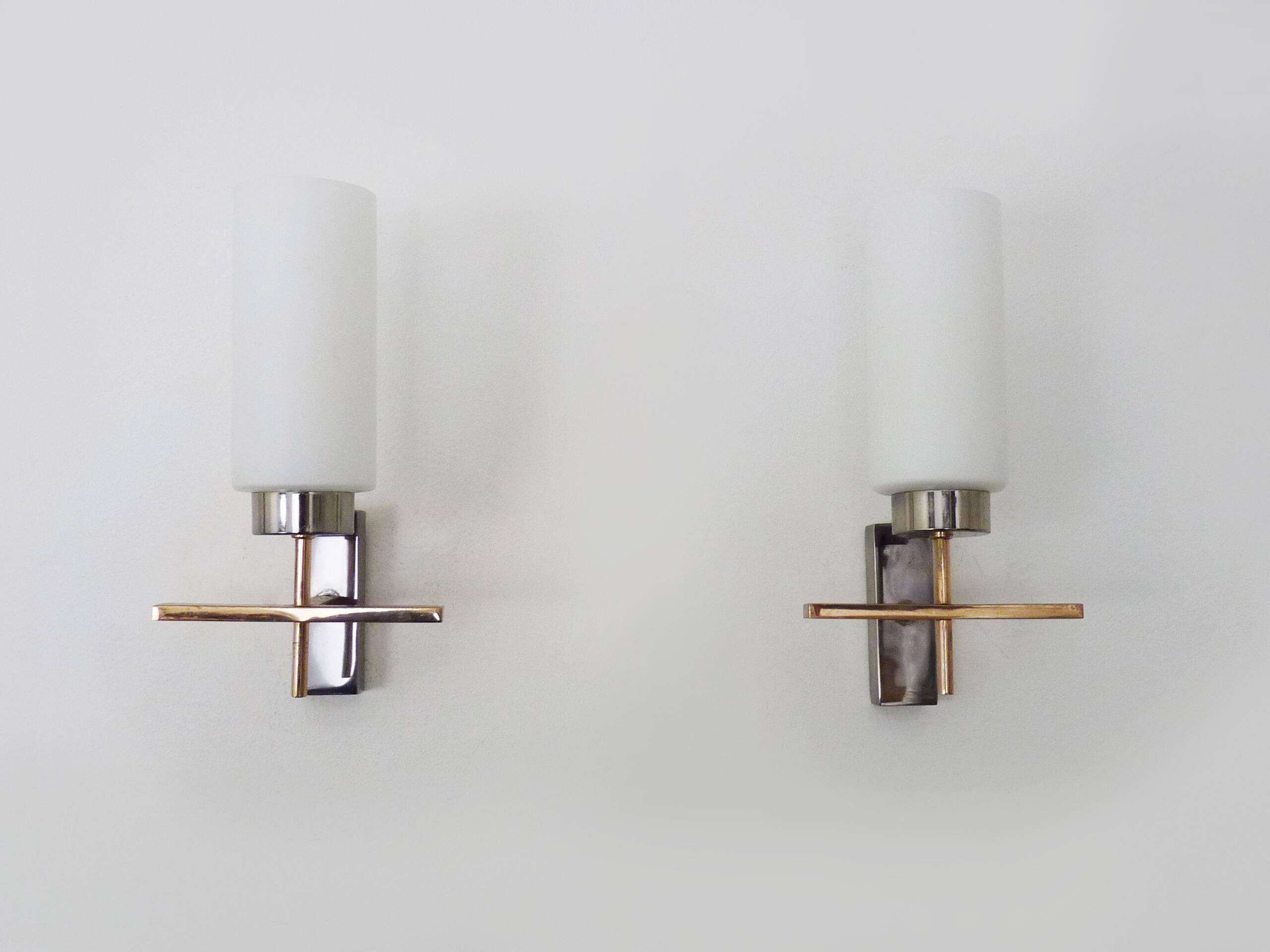 Pair of chrome-plated metal and opaline brass wall lights. 1960s