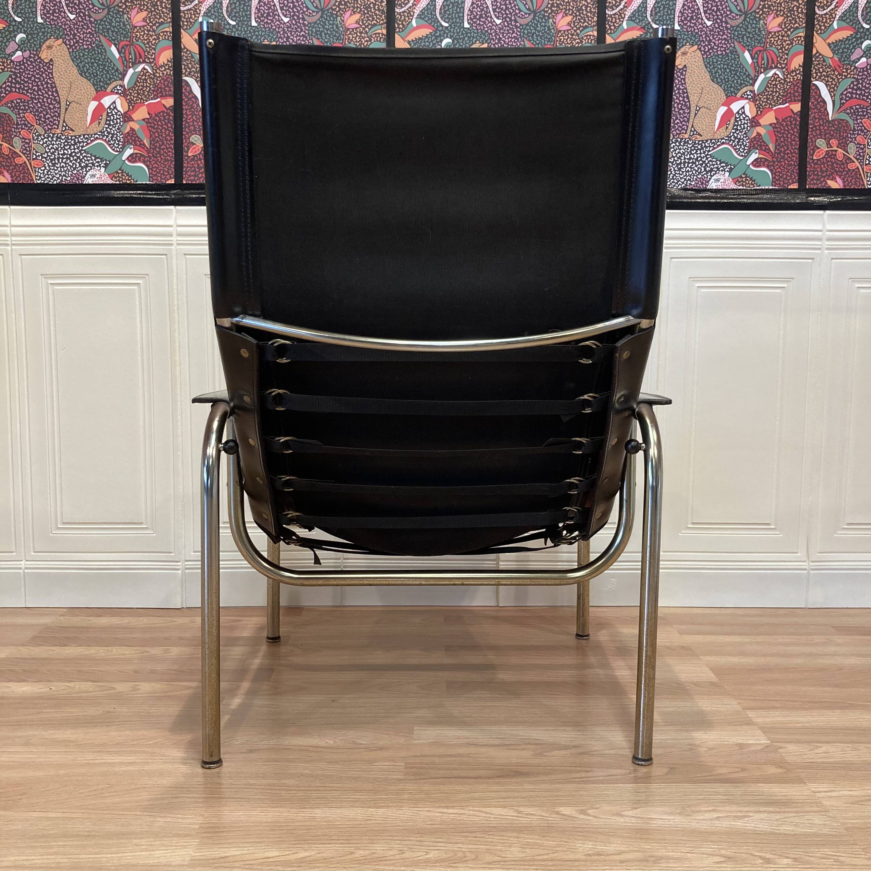 Reclining armchair in black leather and chrome design "hans eichenberger" 1960.