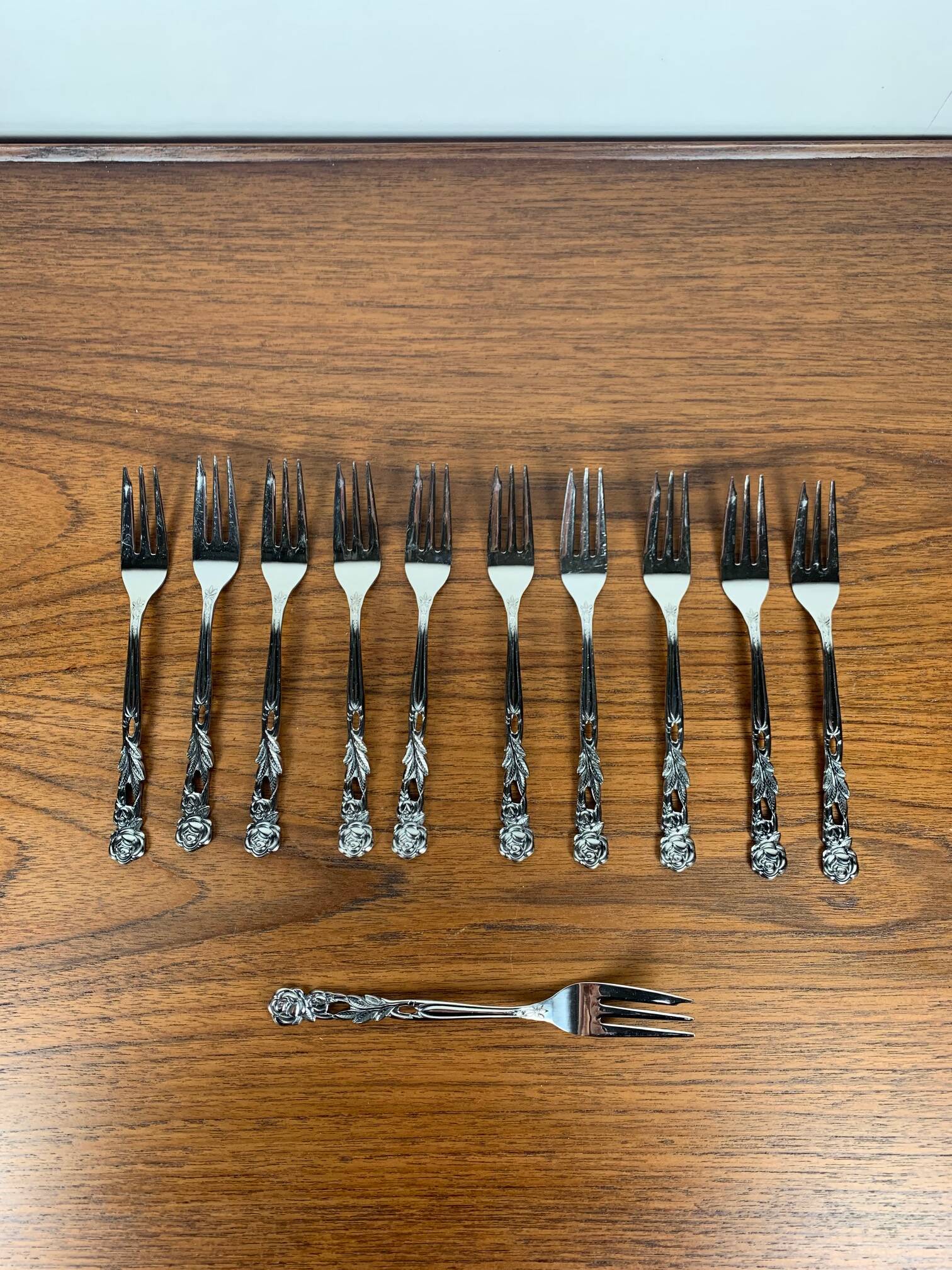 Set of 10+1 Japanese stainless steel dessert forks, rose pattern, 1970