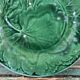 Pair of green slip plates with leaf decoration, 19th century