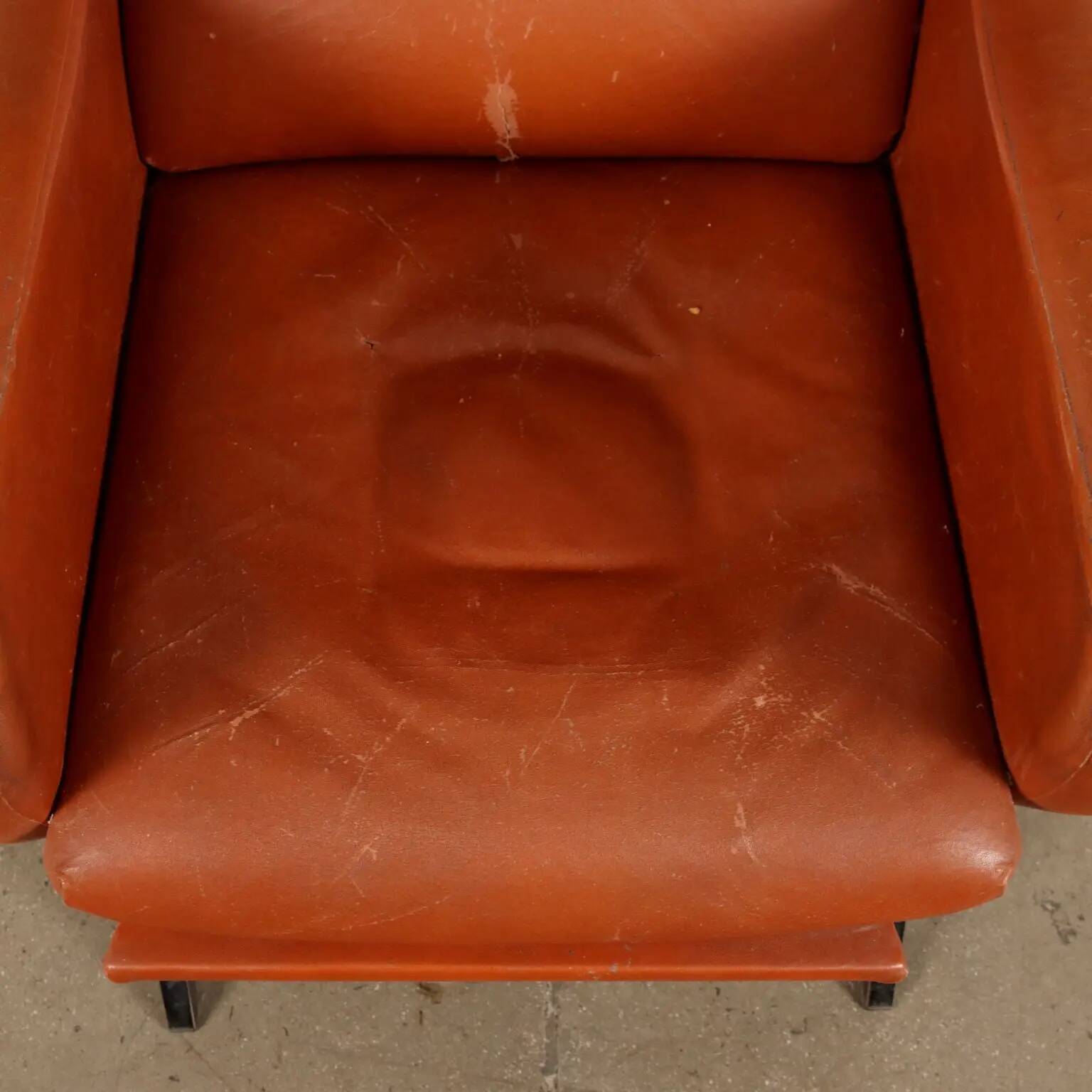 Vintage armchair from the 1970s in foam, faux leather, and metal.