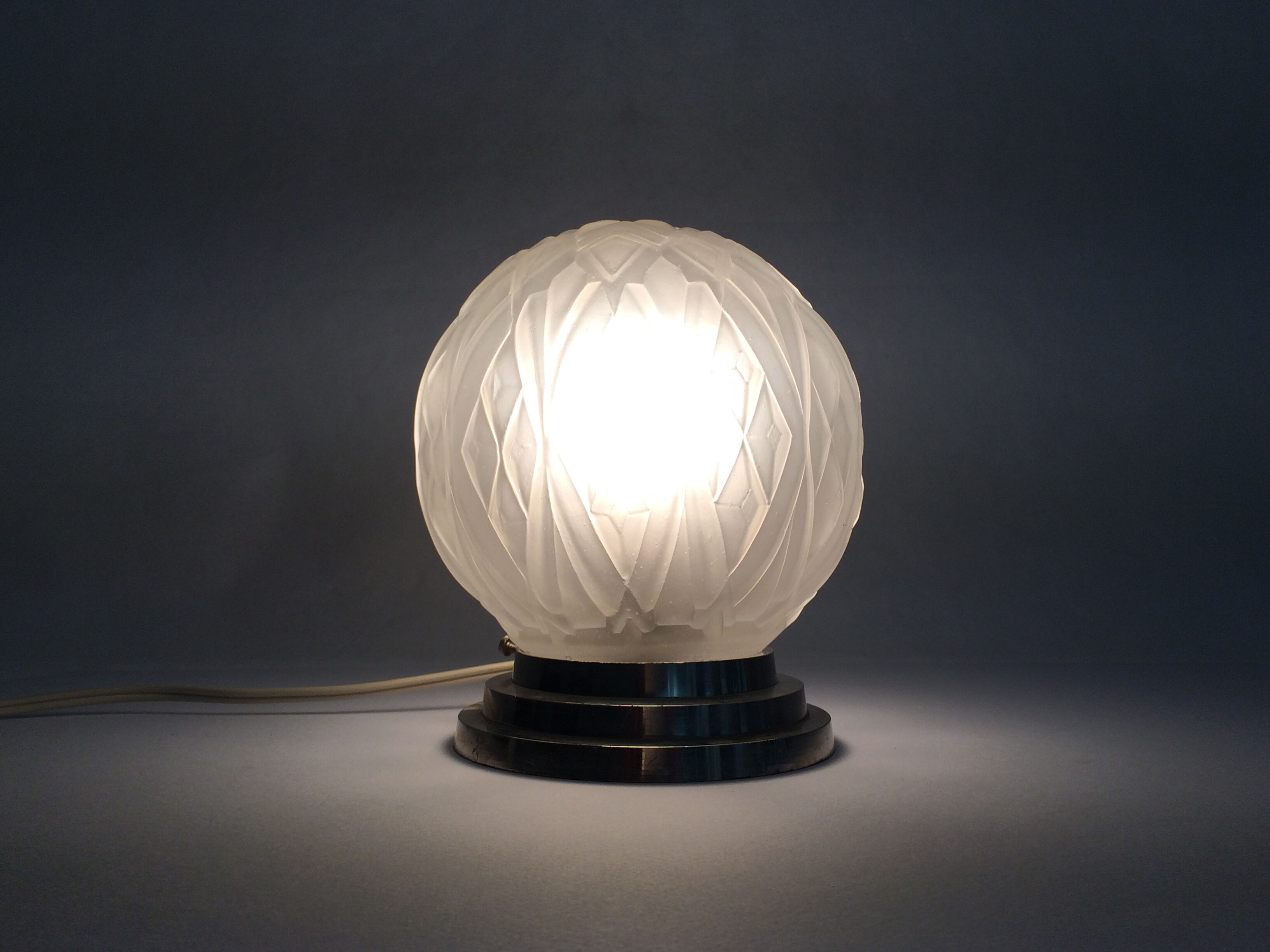 Chrome metal and Art Deco glass globe