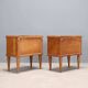 Pair of wooden and glass bedside tables from the 1950s.