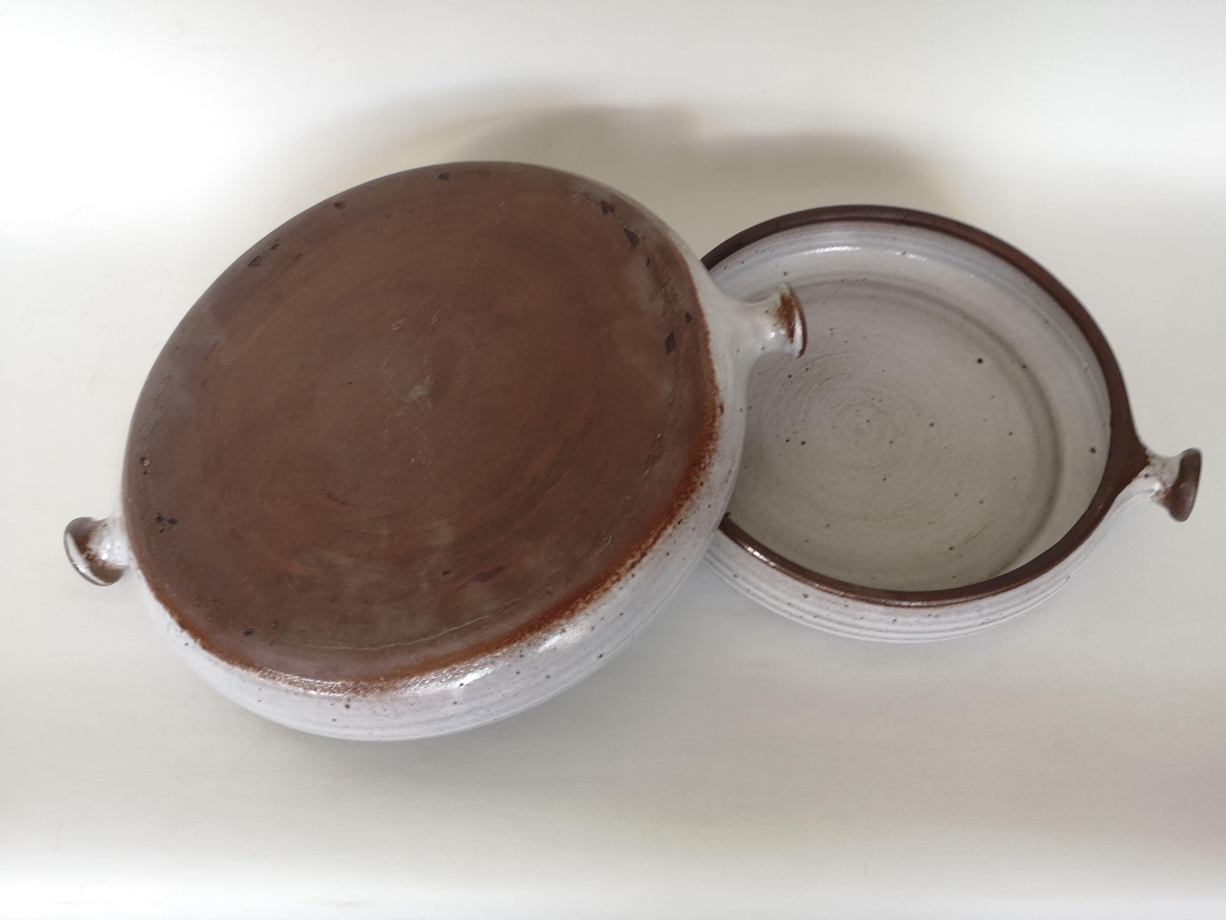 Pair of enamelled sandstone dishes