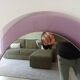 Vintage oval plexiglass mirror from the 70s by Harvey Guzzini