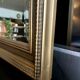 Large antique beveled mirror in the Napoleon III style - Gold and black frame