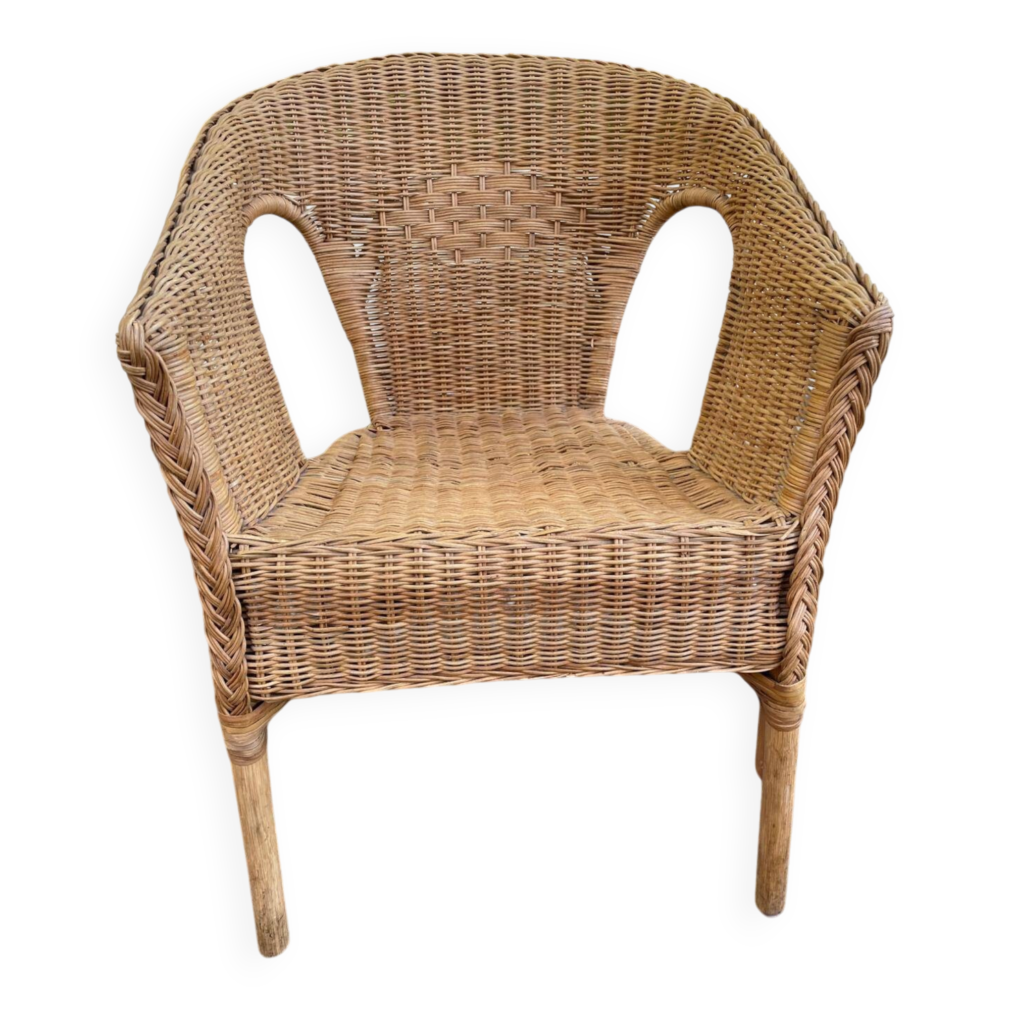 Rattan and woven wicker armchair in vintage bohemian style