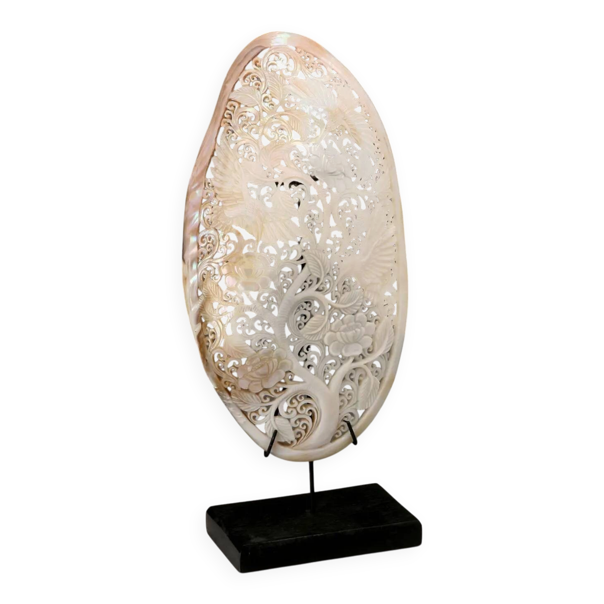 Perforated shell hand-decorated on a wooden base