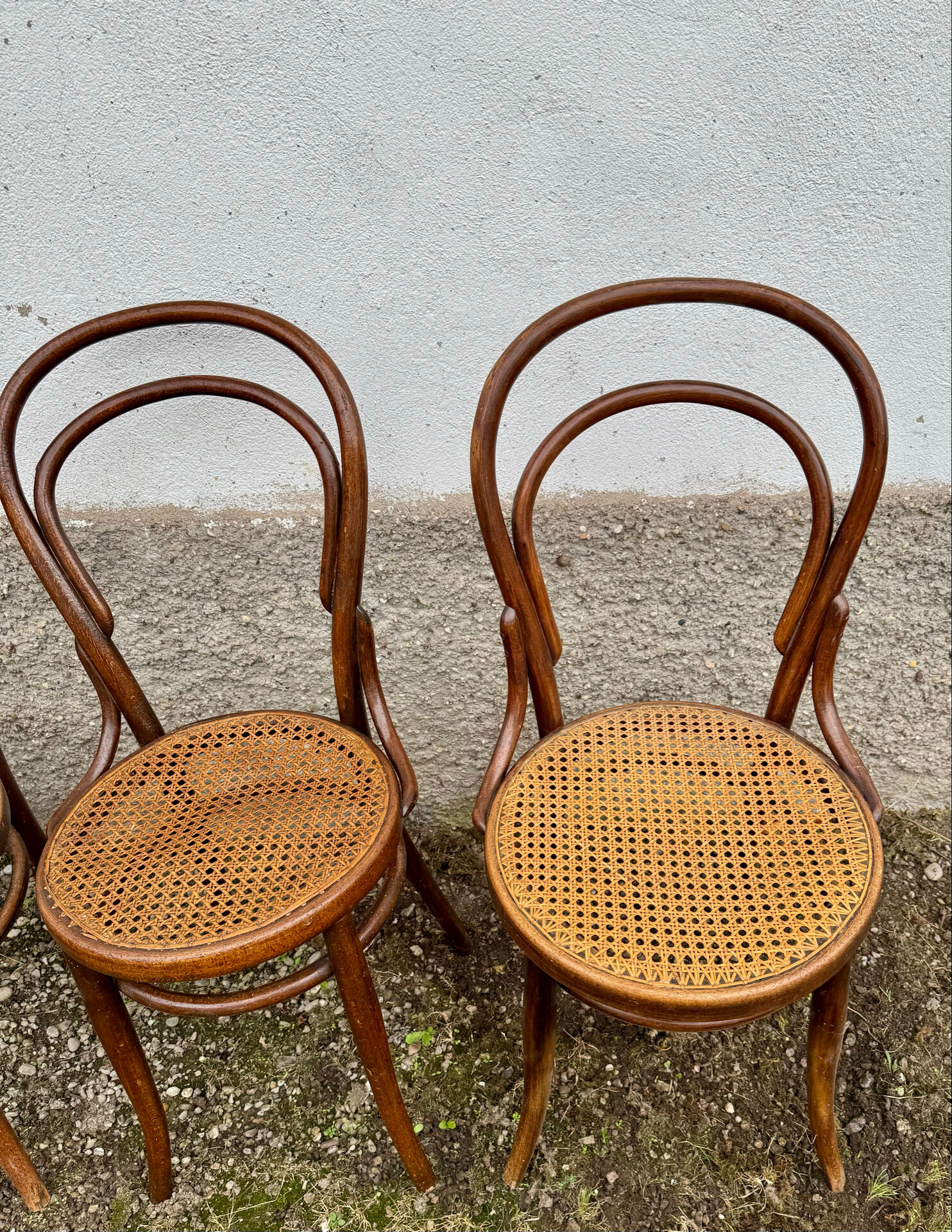 Set of 10 bentwood bistro chairs with cane seat.